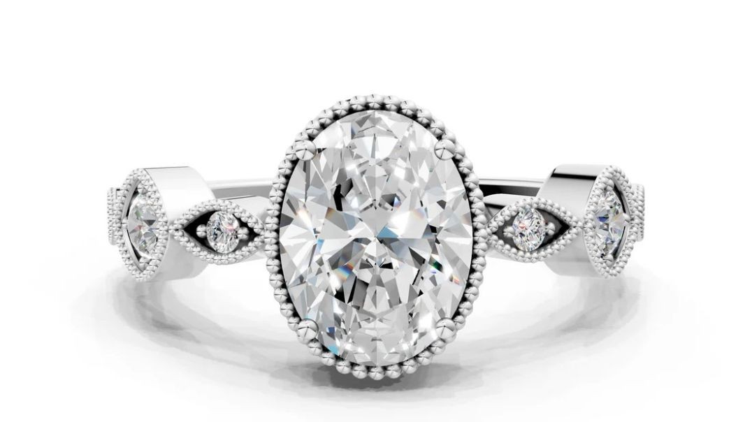 ⁣White gold Oval Cut Diamond Vintage Milgrain Ring with Round Stations